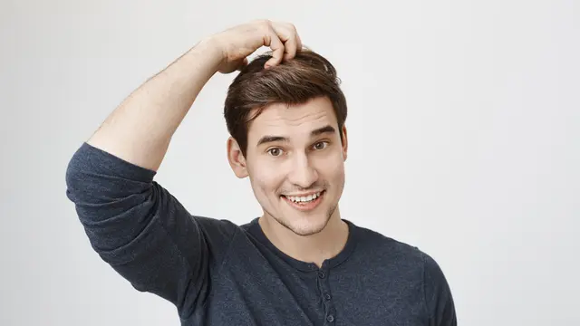 046163600_1702361249-surprised-clueless-guy-smiling-scratch-head